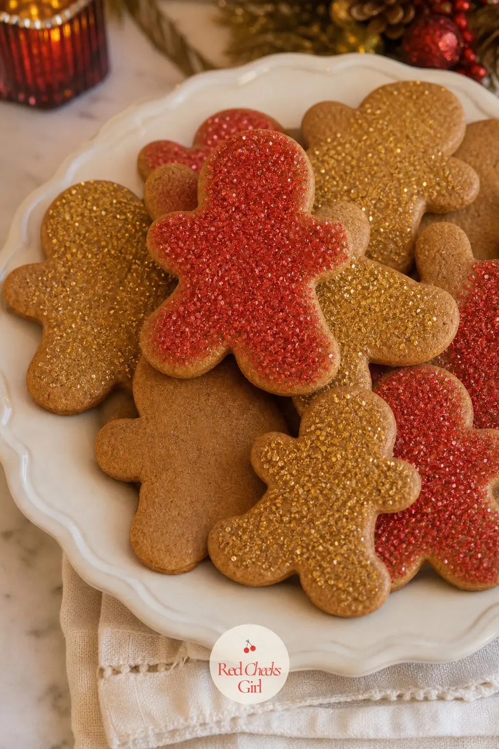 A Gingerbread Plate Finished in Red and Gold Sugar — Stack gingerbread on a cream plate and finish only a few with warm red and gold sanding sugar, leaving the