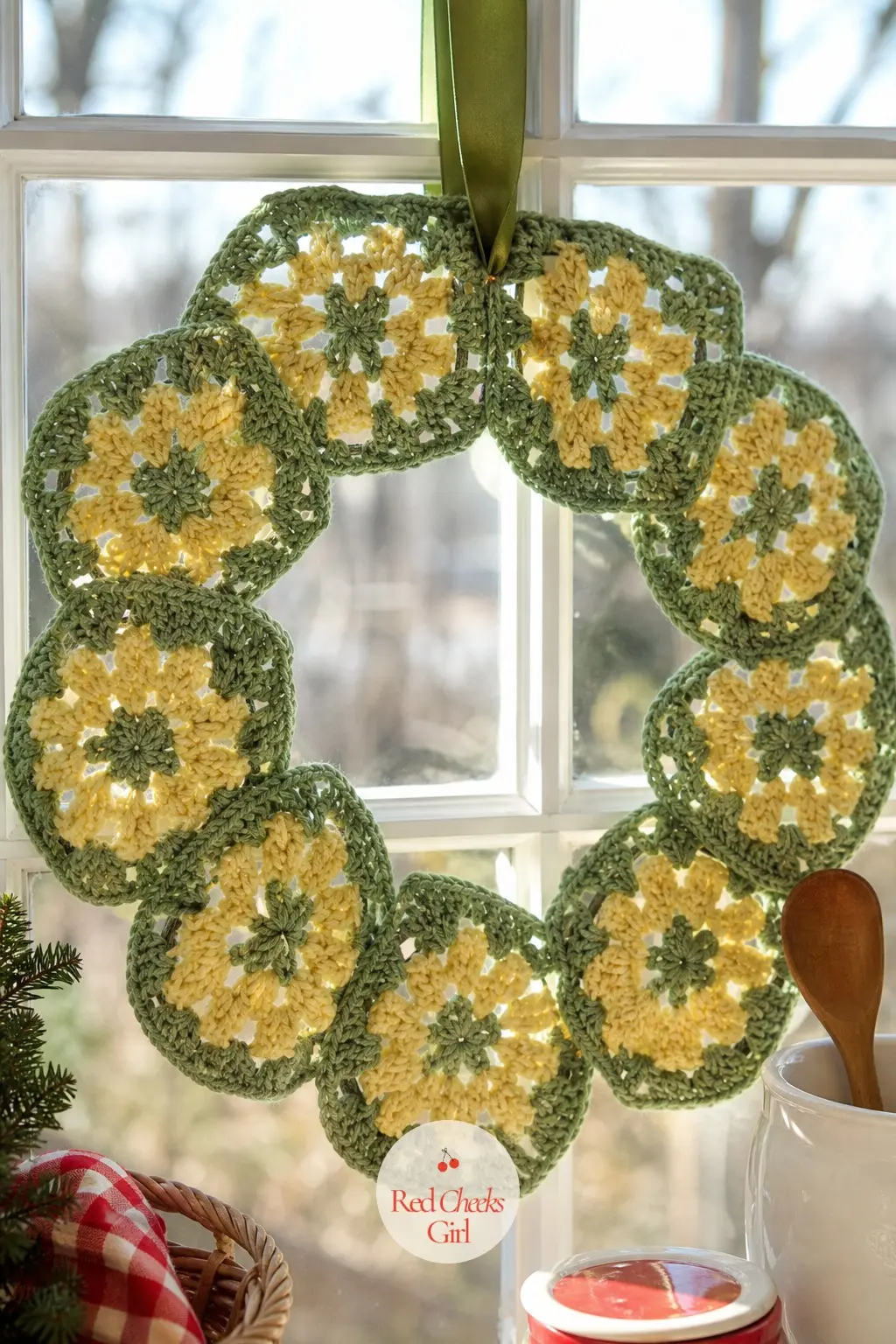 The Sage and Butter Yellow Granny Square Wreath for the Kitchen Window — Soft sage green squares alternate with butter yellow centres, giving the wreath a