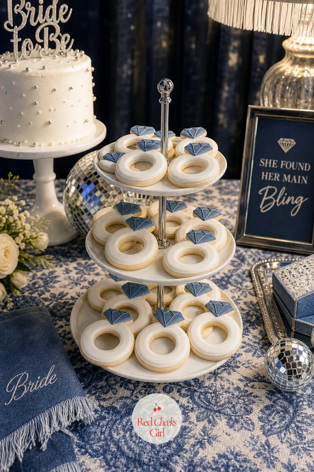 Diamond Ring Cookies — These are the cookies the group actually fights over: a ring shape iced in white with a single blue or silver stone piped into the