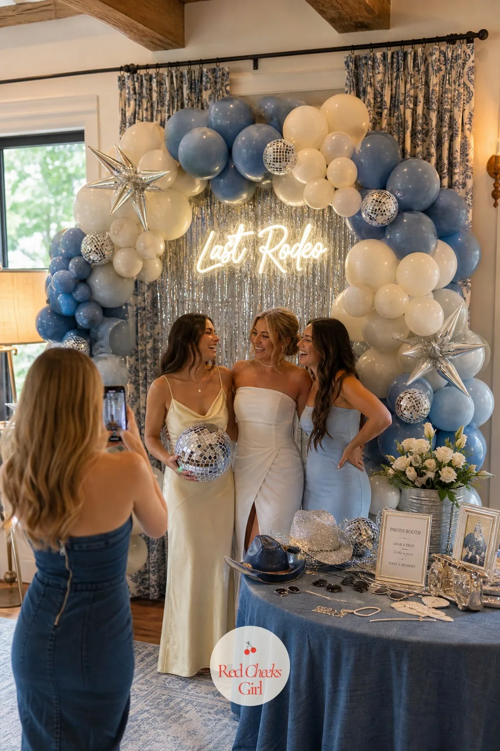 Photo Booth Arch — Somewhere separate from the main backdrop, a smaller arch gives the group a second photo spot so the first one does not get crowded all