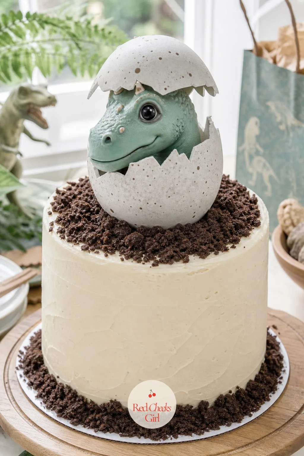 Hatching Dino Egg Cake — A plain round cake says birthday, but it does not say dinosaur, and this is the one dessert worth the extra twenty minutes. Dinosaur
