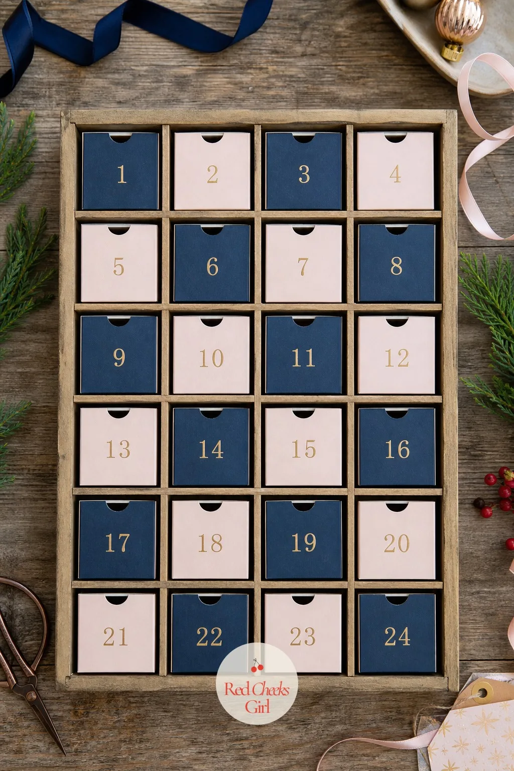 Painted Matchbox Grid — A grid of tiny drawers reads as expensive even when it is twenty-four empty matchboxes covered in paper. Diy advent calendar