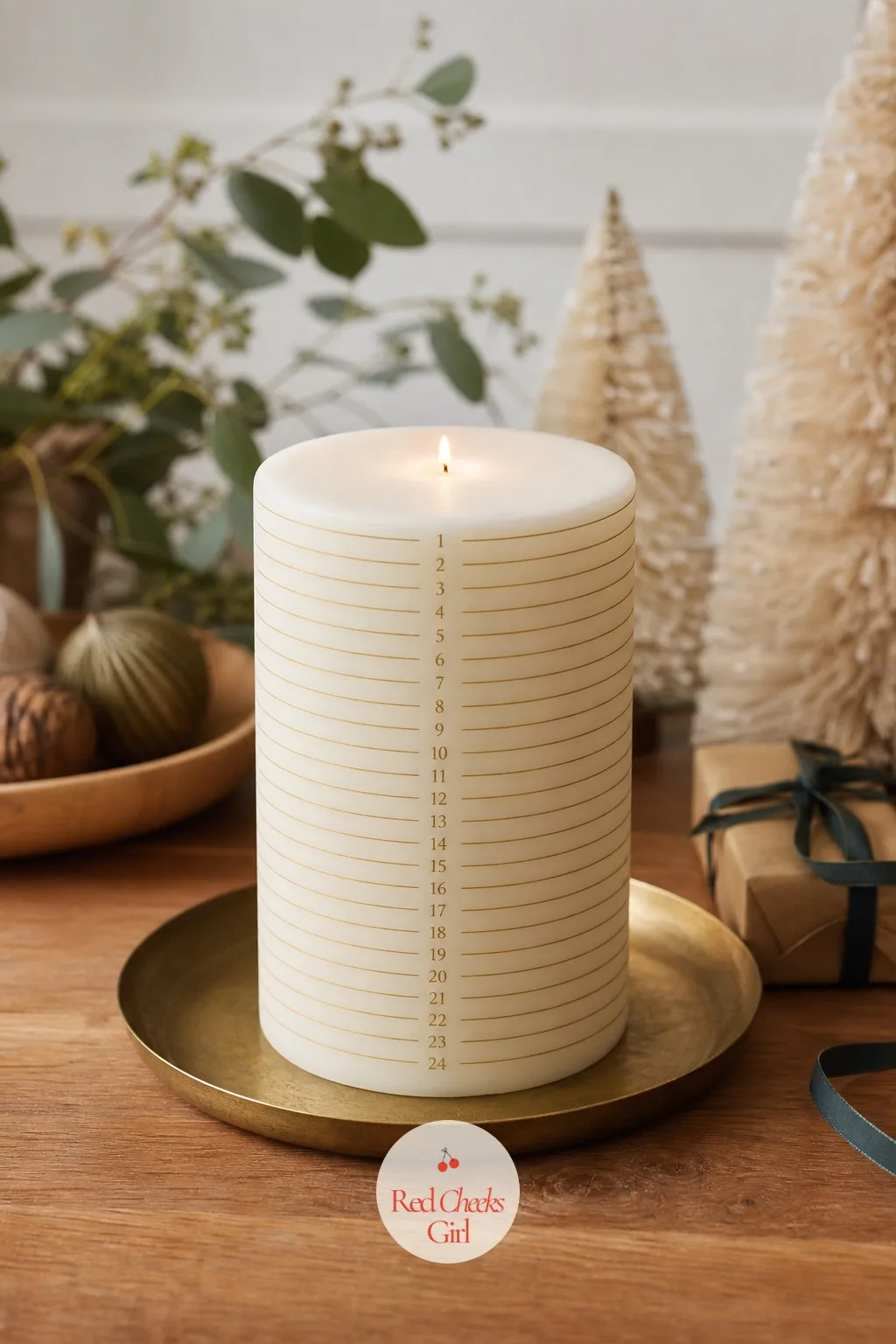 Scored Advent Candle — A tall pillar candle marked with twenty-four thin gold lines turns an ordinary evening ritual into something worth sitting still for.