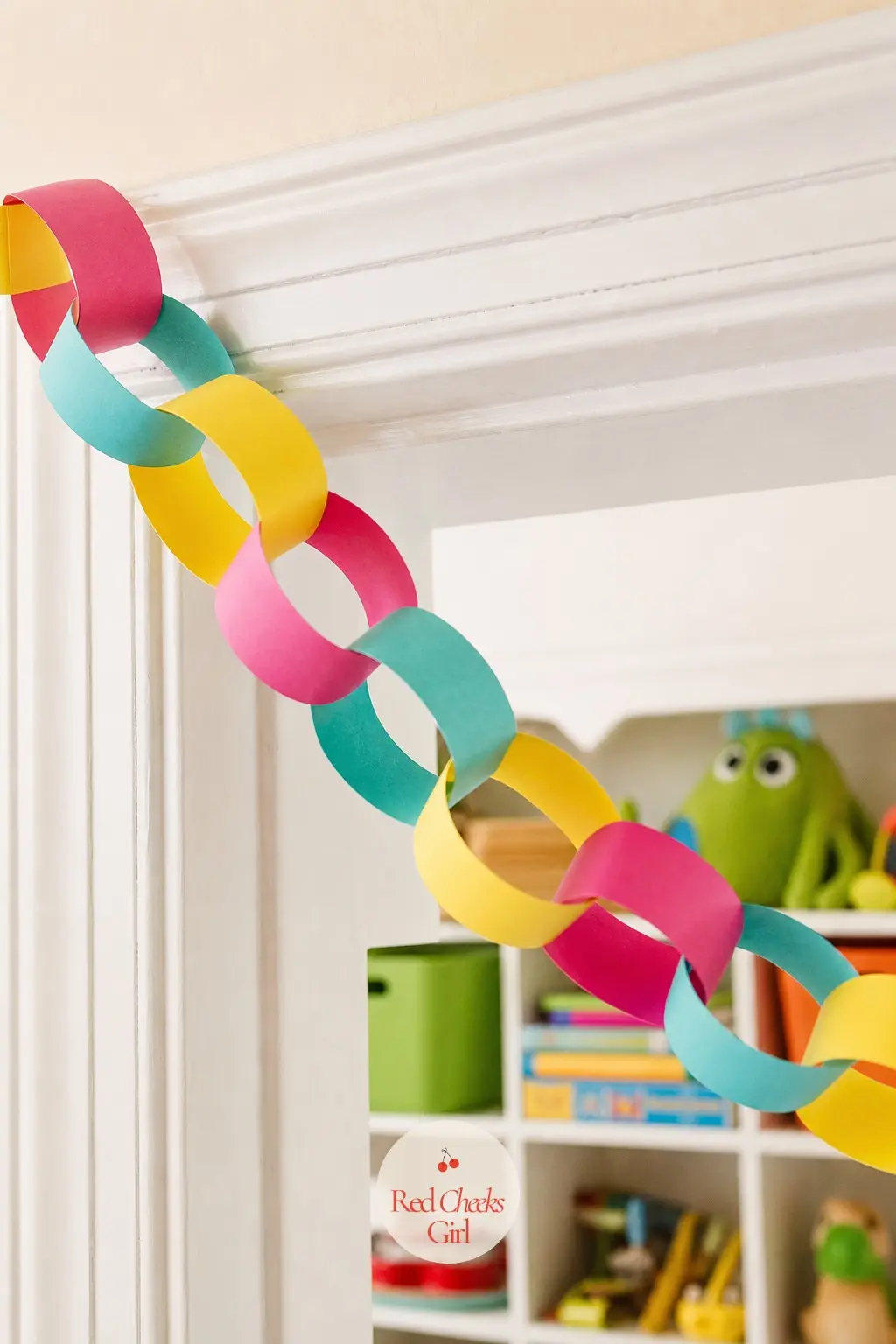 Paper Chain Rings Garland — Strips of lemon, turquoise and hot pink construction paper looped and glued into a chain turn this into a candy colored update on a