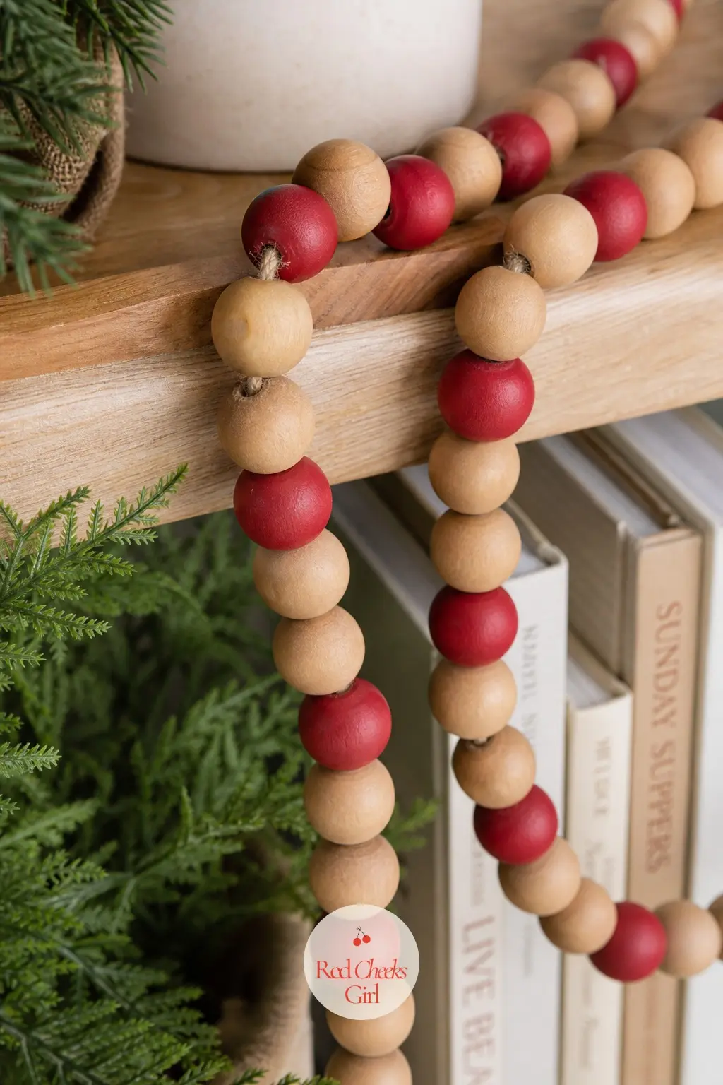 Wooden Bead Garland — Honey toned wooden beads strung on jute with a handful painted barn red give a natural garland just enough color without tipping into