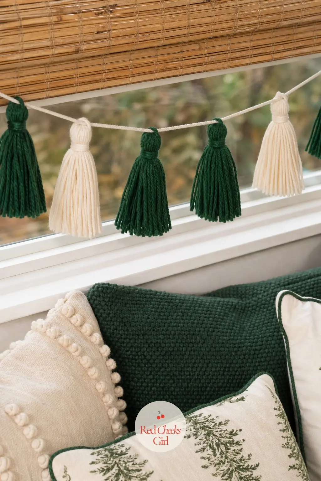 Yarn Tassel Garland — Forest green and cream yarn wound around cardboard and tied off makes a tassel in a couple of minutes, and a row of them along cord reads