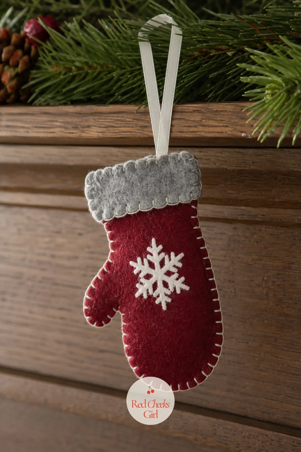 Cut-and-Glue Felt Mitten — A mitten shape is forgiving of an uneven cut in a way a snowflake never is, which makes it the one to practise on before anything