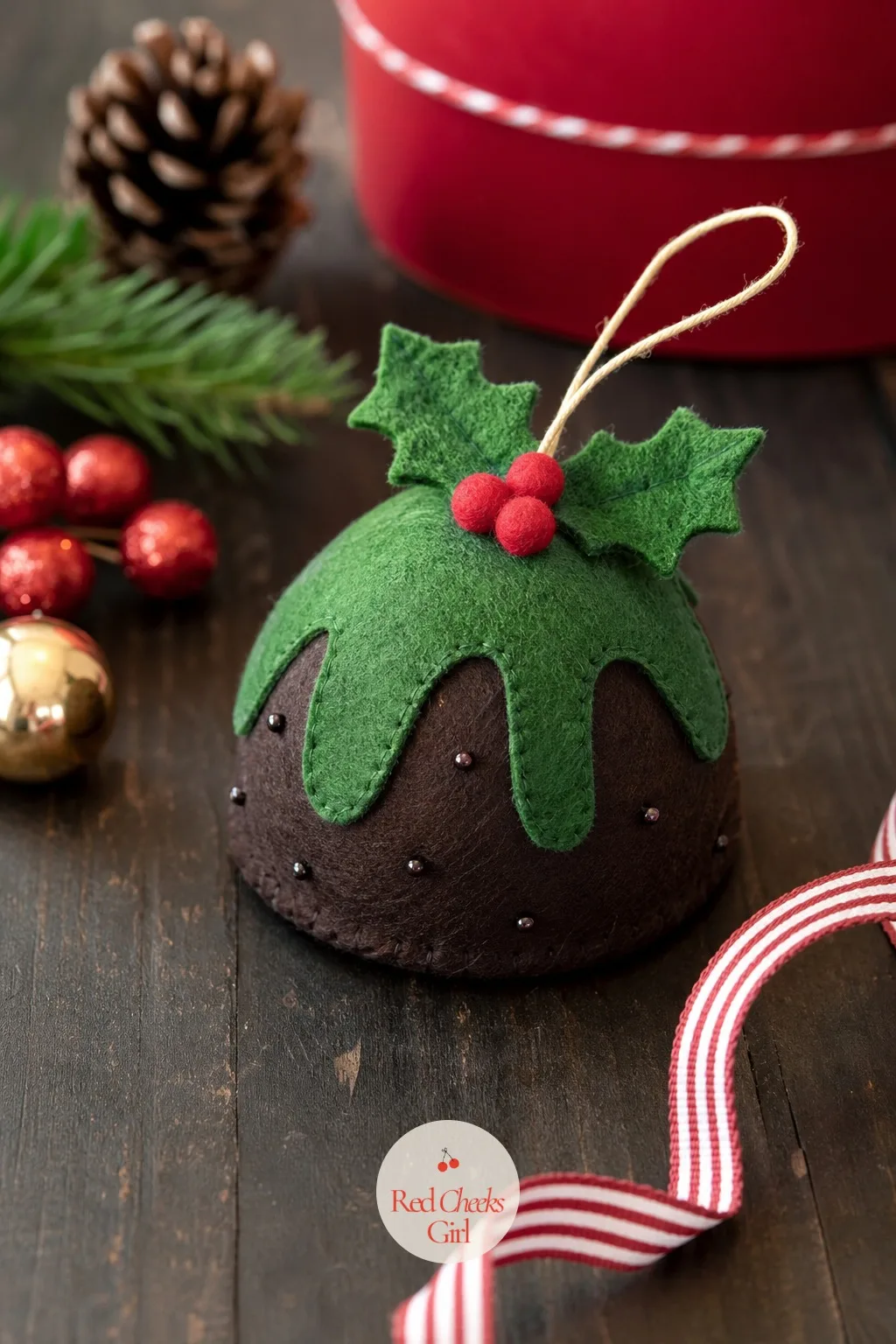 Felt Christmas Pudding — An odd little shape to explain to anyone who did not grow up with it, and exactly the sort of thing that starts a conversation at a