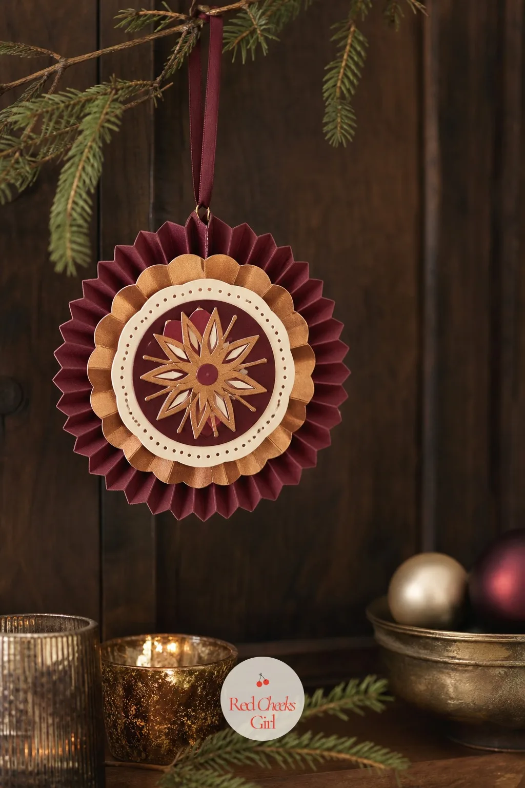Burgundy And Copper Layered Medallion — Three or four circles, each slightly smaller than the last, stacked and glued at the centre so the edges fan out in a