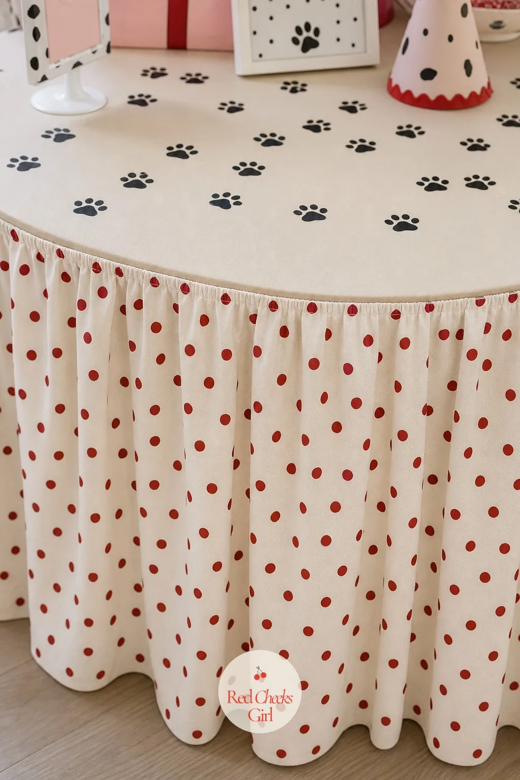 Polka Dot Table Skirt with Paw Print Confetti — The table is doing a lot of visual work, so it earns a proper skirt rather than a flat paper cloth that slides