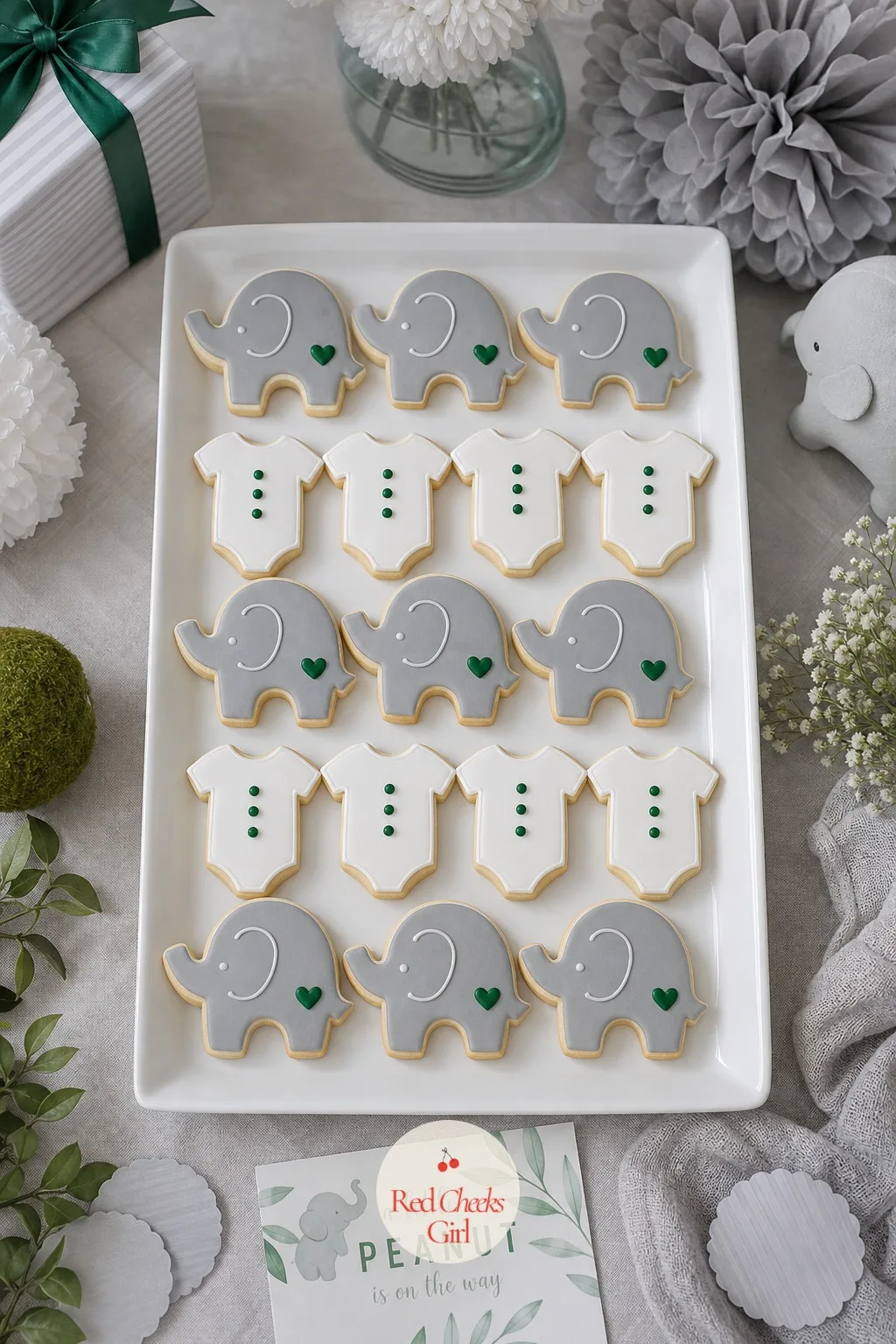 Elephant And Onesie Cookies — A platter that mixes two shapes reads as more thought-out than one shape repeated twenty times. Elephant baby shower theme
