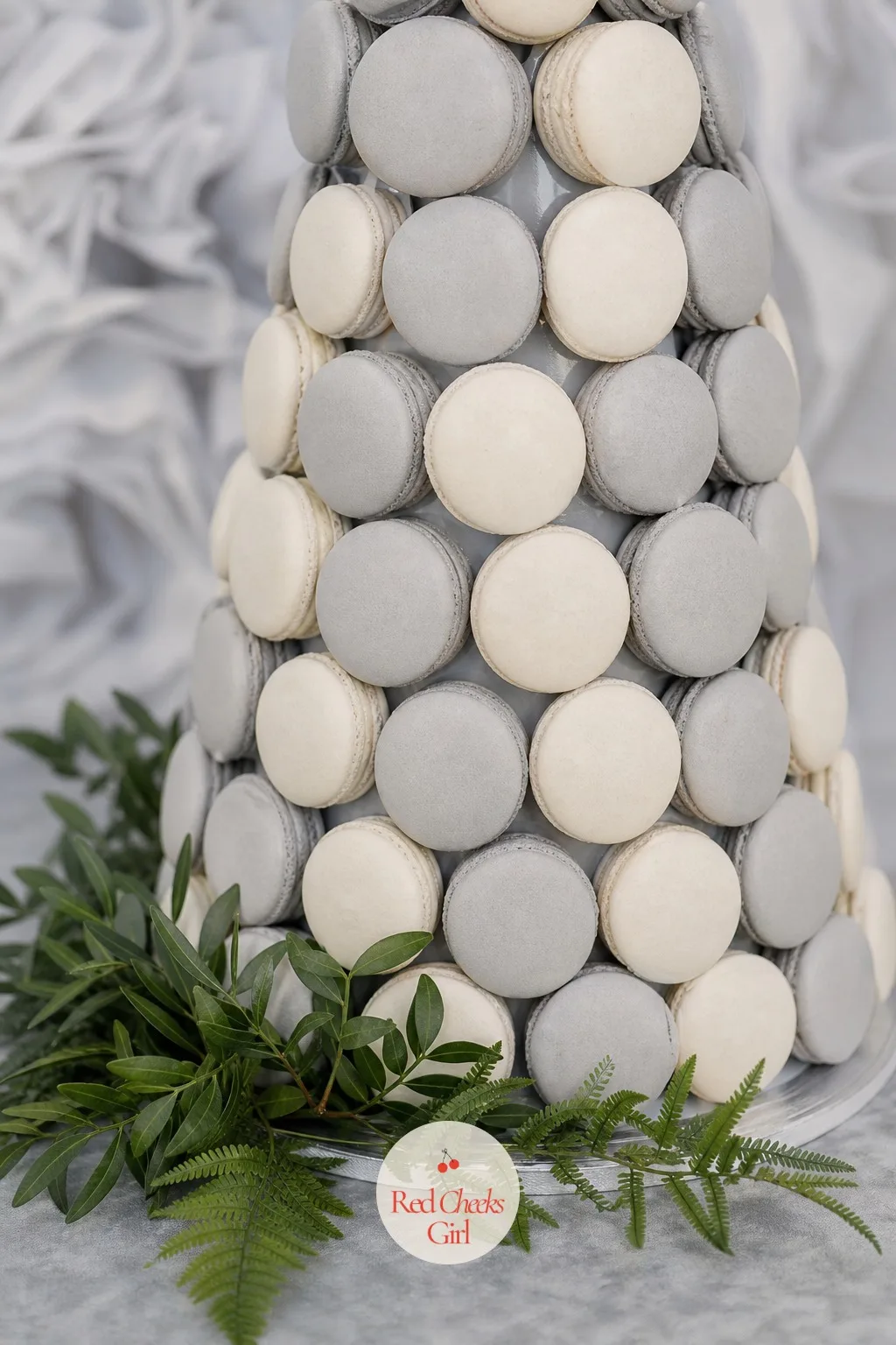 The Gray And White Macaron Tower — A dessert table needs one piece that is purely about color, no character on top, no shape to explain. Elephant baby shower