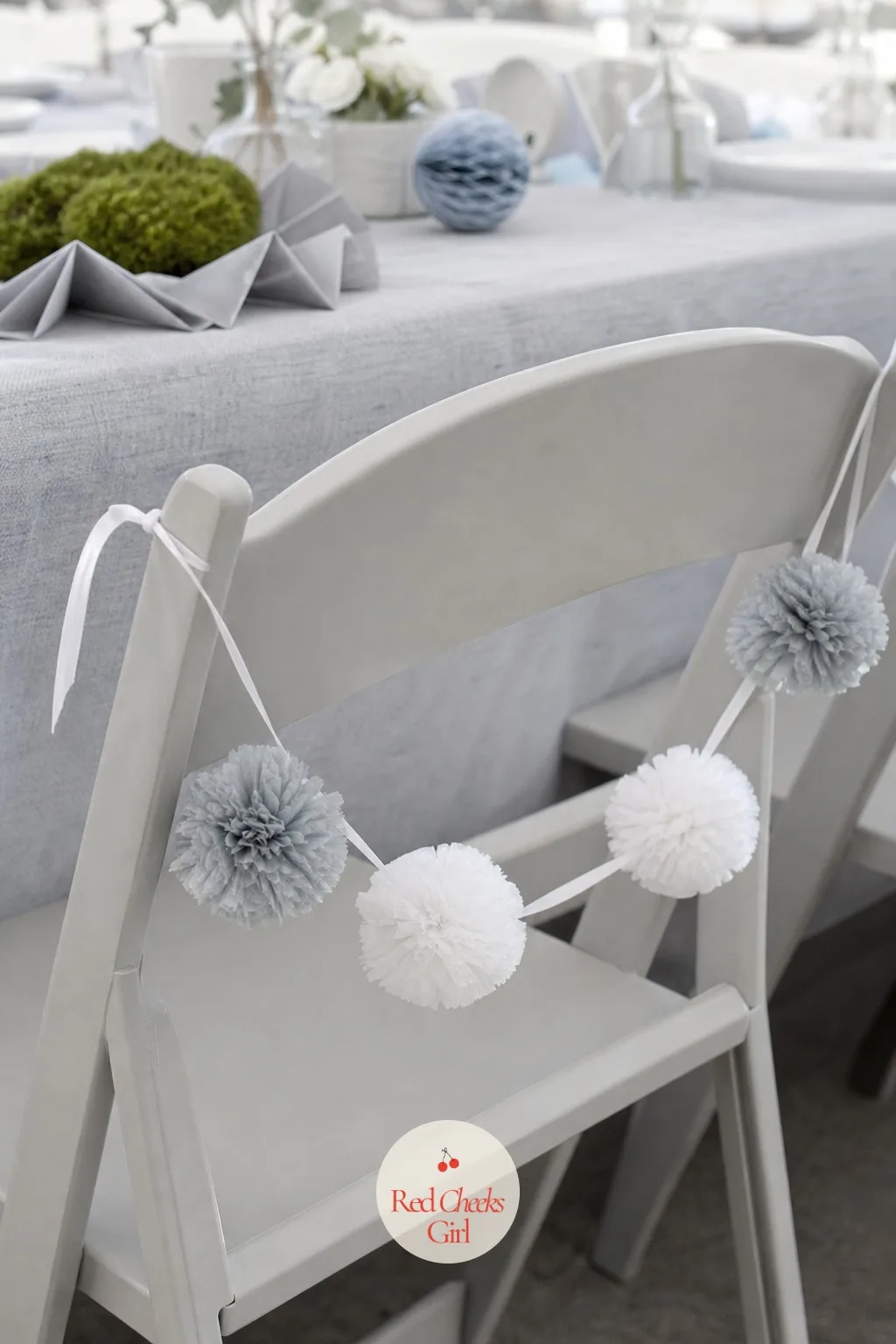 Gray And White Pom Garland On Every Chair — This is the touch nobody mentions out loud but everyone notices in photographs, the seating that looks dressed