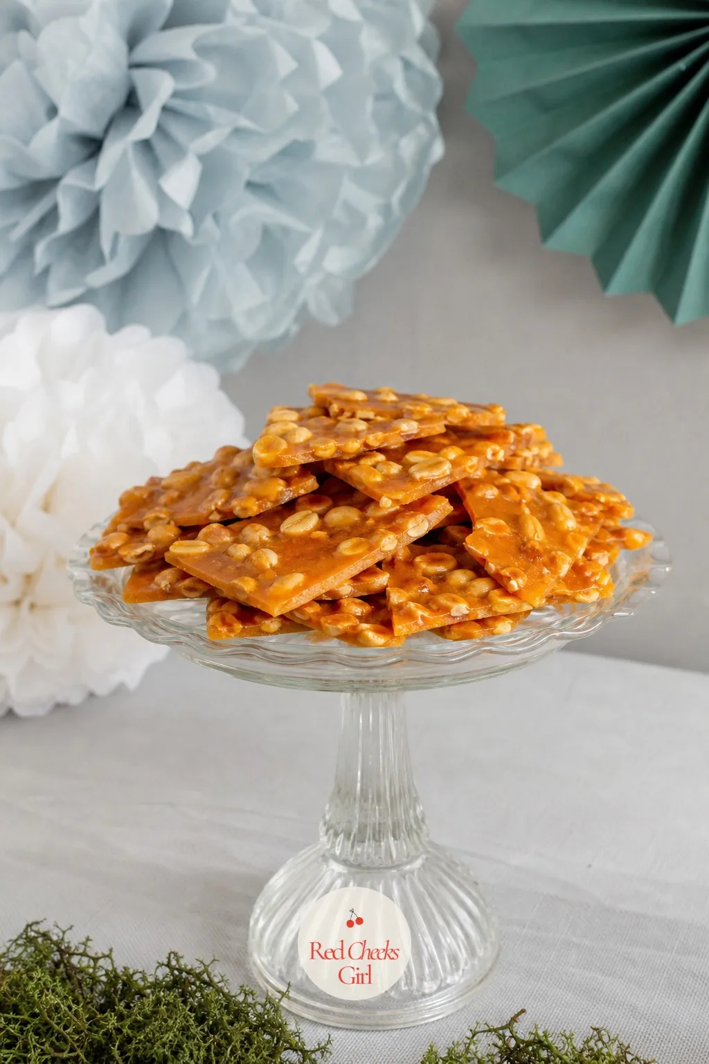 Peanut Brittle Shards On A Pedestal — This is the one piece on the table that plays the pun completely straight, broken shards of peanut brittle piled high on