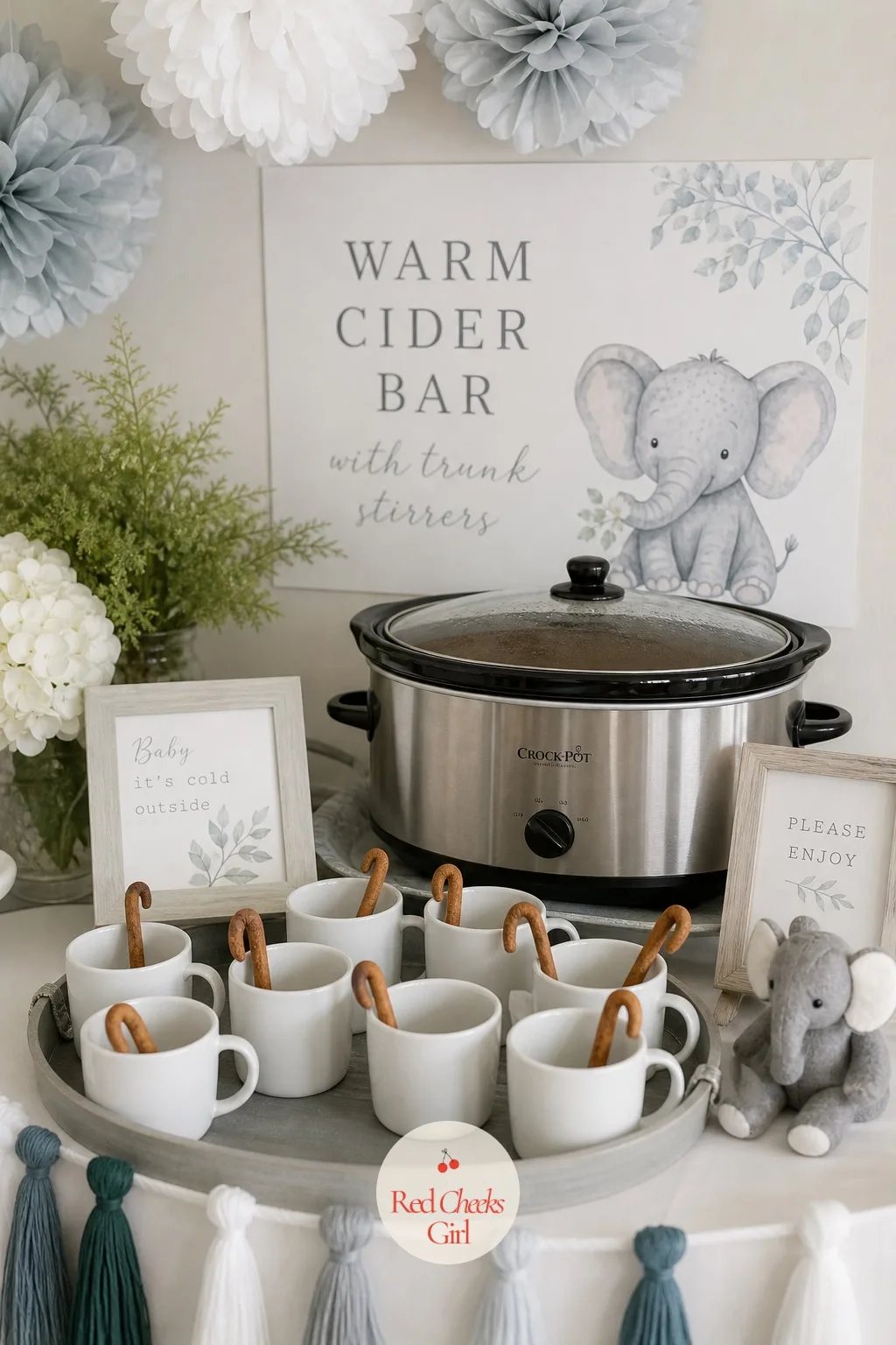 The Warm Cider Bar With Trunk Stirrers — For a cooler weather shower, a hot drink station gives guests a reason to linger near the dessert table instead of