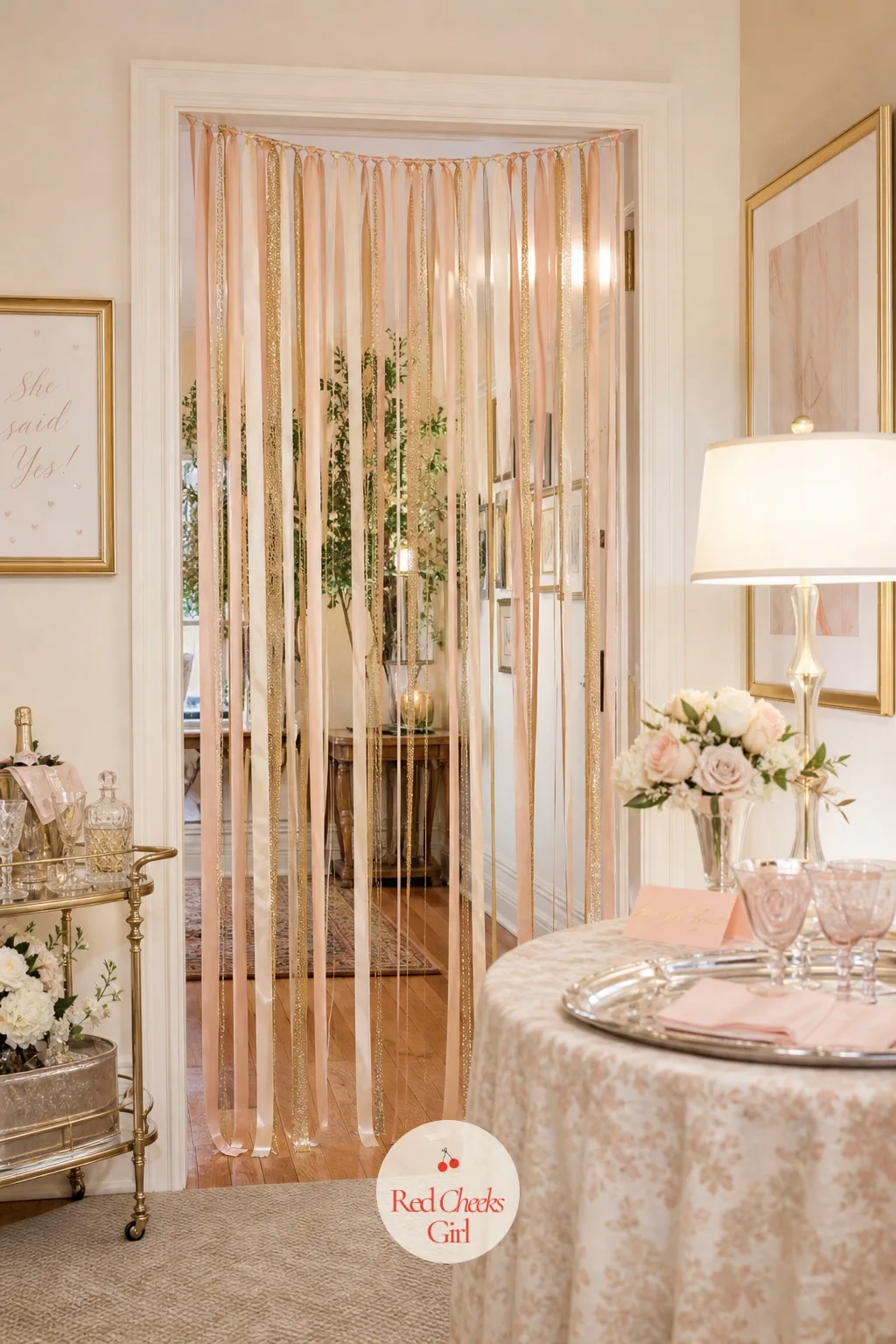 Doorway Ribbon Streamer Curtain — Hung across the doorway between rooms, a curtain of satin ribbon streamers in blush and champagne gold gives guests something