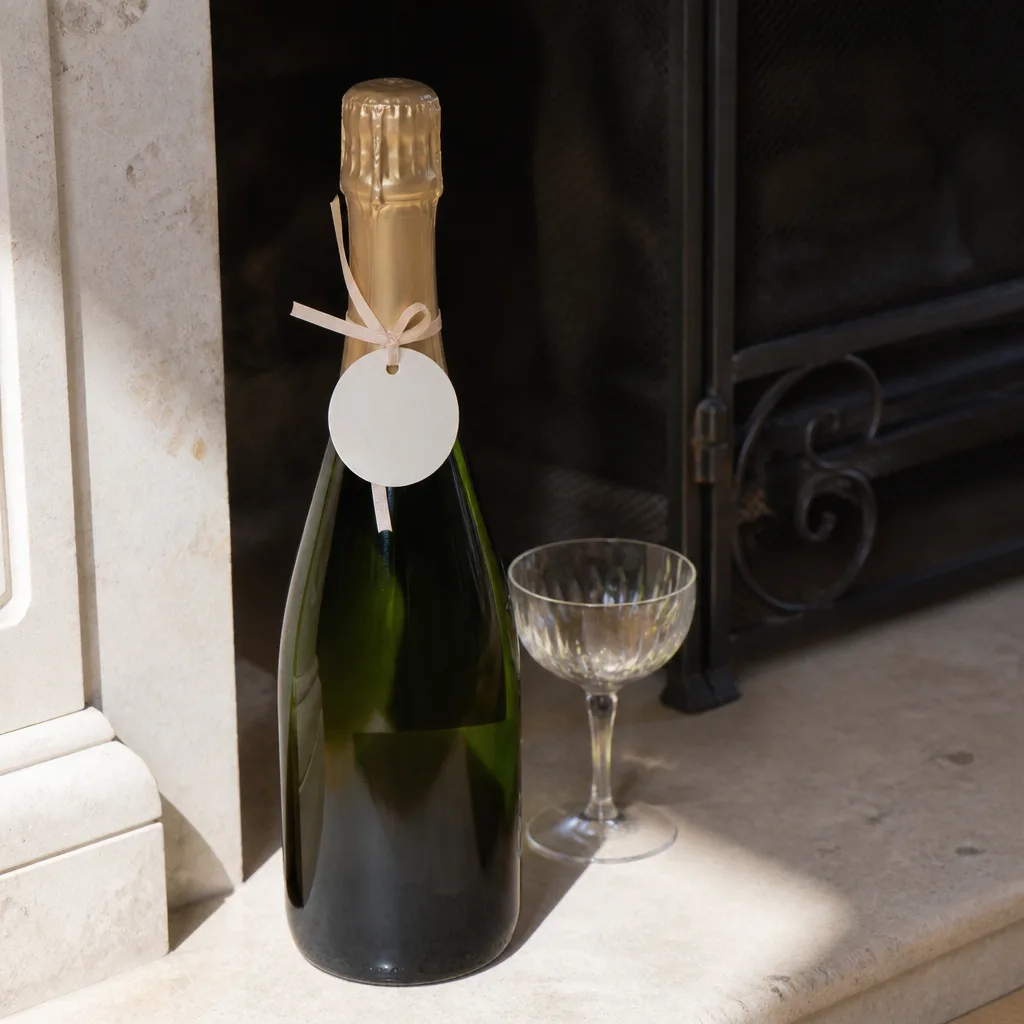 Bottle Of Champagne With A Toast Tag — Sometimes the gift is simply permission to celebrate tonight, not at some future party. Engagement gift ideas