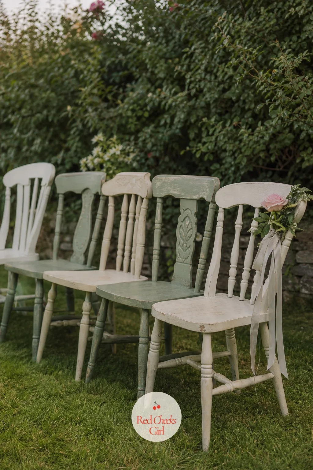 Mismatched Vintage Garden Chairs — A row of identical white folding chairs reads as a conference room, not a garden wedding. English garden wedding