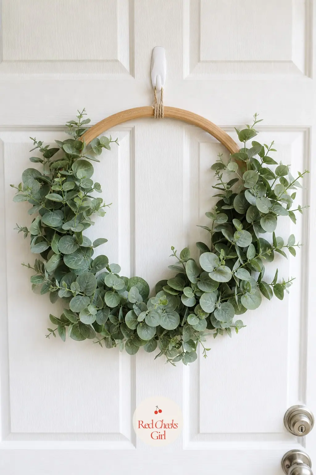 The No-Mess Faux Eucalyptus Wreath for the Dorm Room Door — For a door you cannot drill into and a schedule with no time for misting, a well-made faux