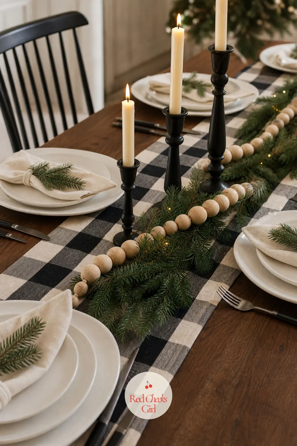 The Dining Table — The table is where the buffalo check gets to be the star: a runner down the centre, cream napkins folded beside each plate, and a low line