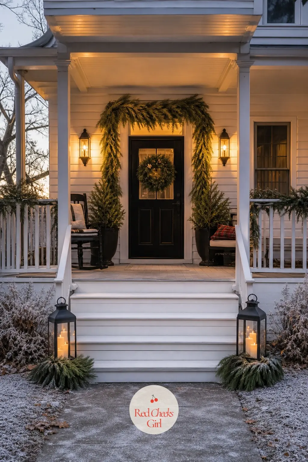 The Porch Lanterns — Two lanterns flanking the steps finish the porch without adding anything new to the palette: black metal, a flameless candle inside each