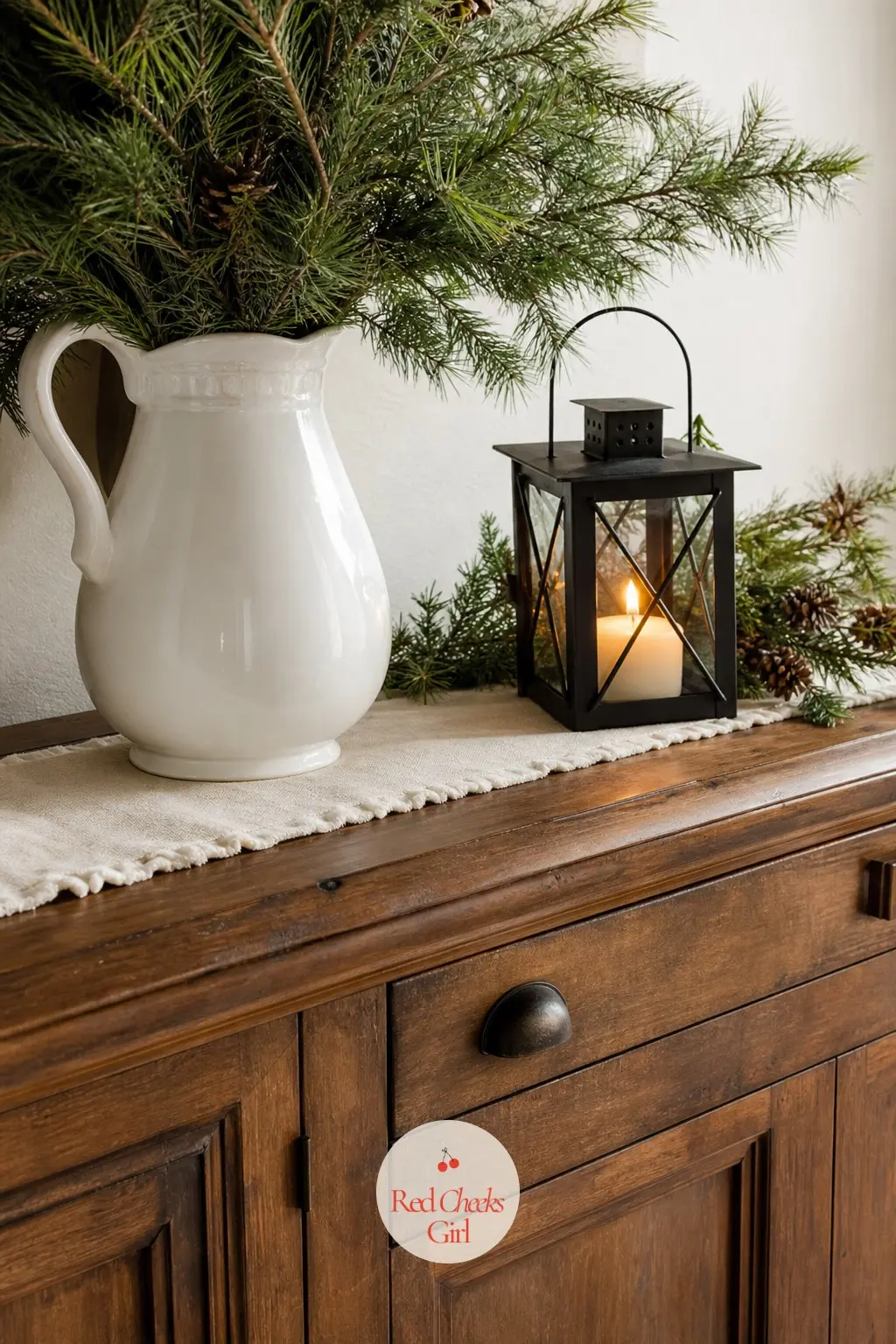 The Sideboard or Buffet — A sideboard only needs three things to earn its place in this room: a pitcher of fresh greenery, a black lantern with a candle