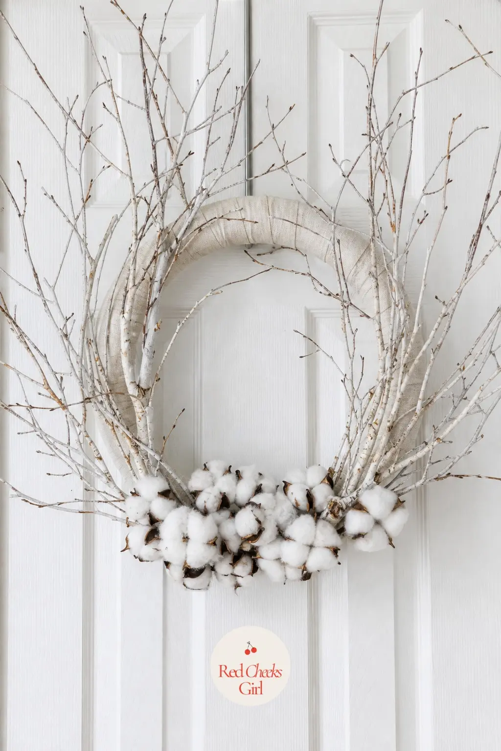 The Cotton Boll and Birch Branch Wreath for the Linen Closet Door — Curled white birch branches fan out past the edge of the wreath form, with cotton bolls