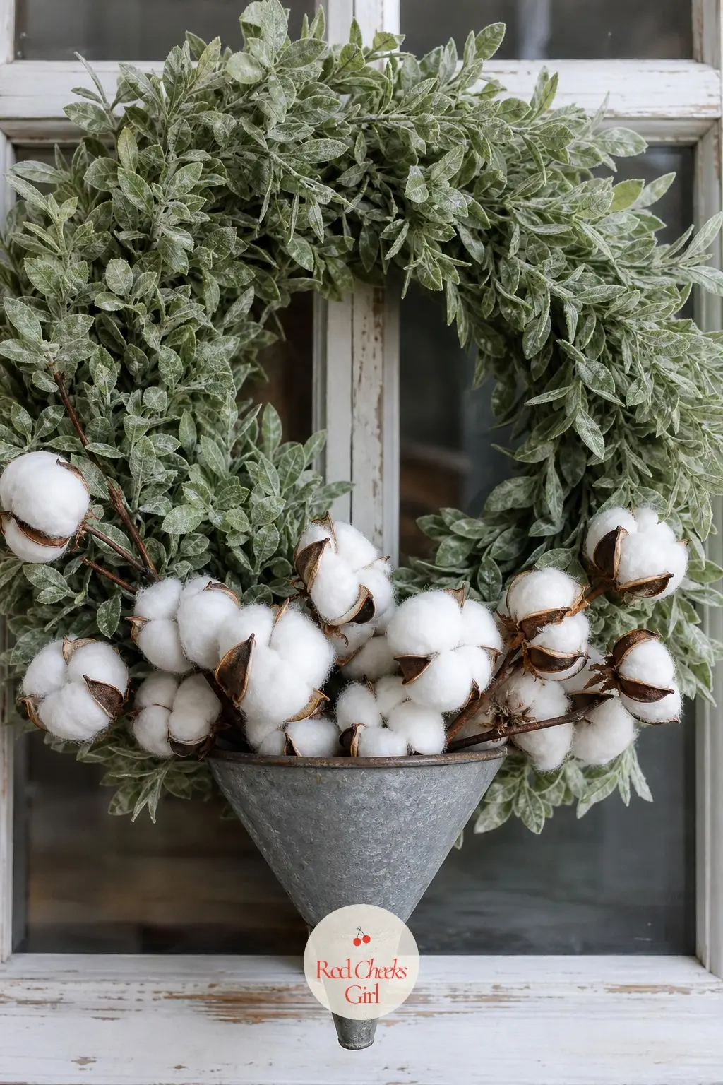 The Galvanized Funnel and Cotton Wreath for the Potting Shed Window — A small galvanized funnel sits wired at the base of a sage-green wreath, playing the part