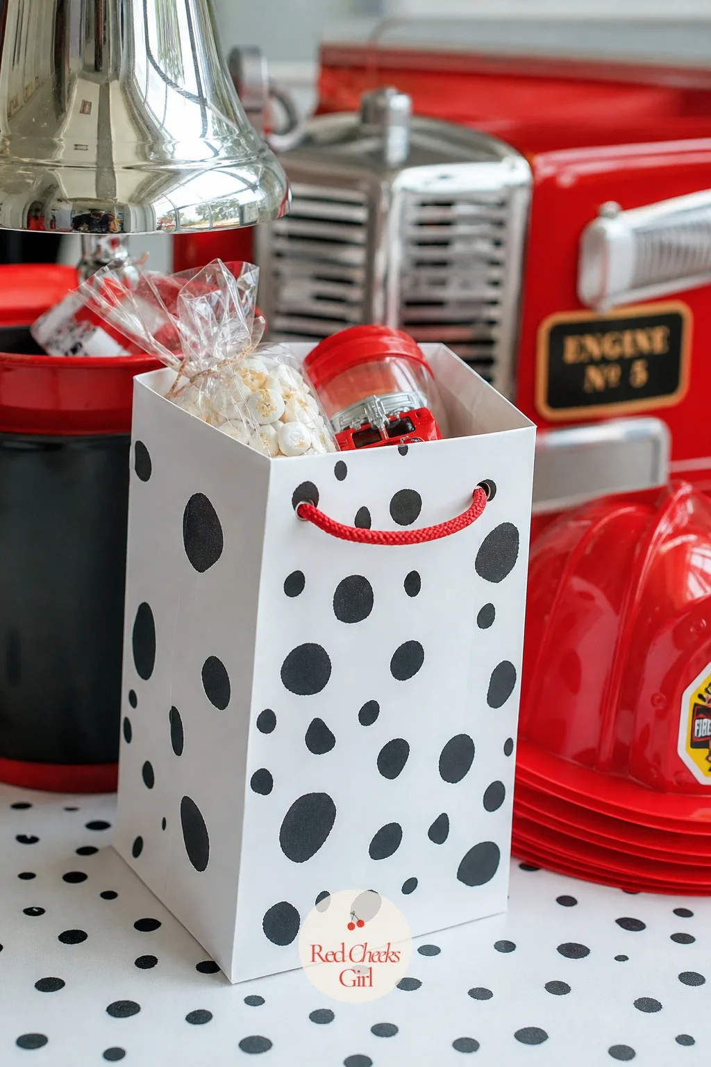 Dalmatian-Spot Favor Bags — A plain paper bag of candy says the party is over. Fire truck birthday party ideas