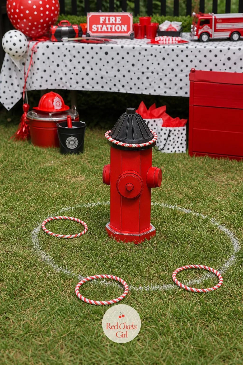 Hoop Toss Over the Hydrant — Real firefighters train on targets, and a child in a plastic helmet wants nothing more than to be treated like one. Fire truck
