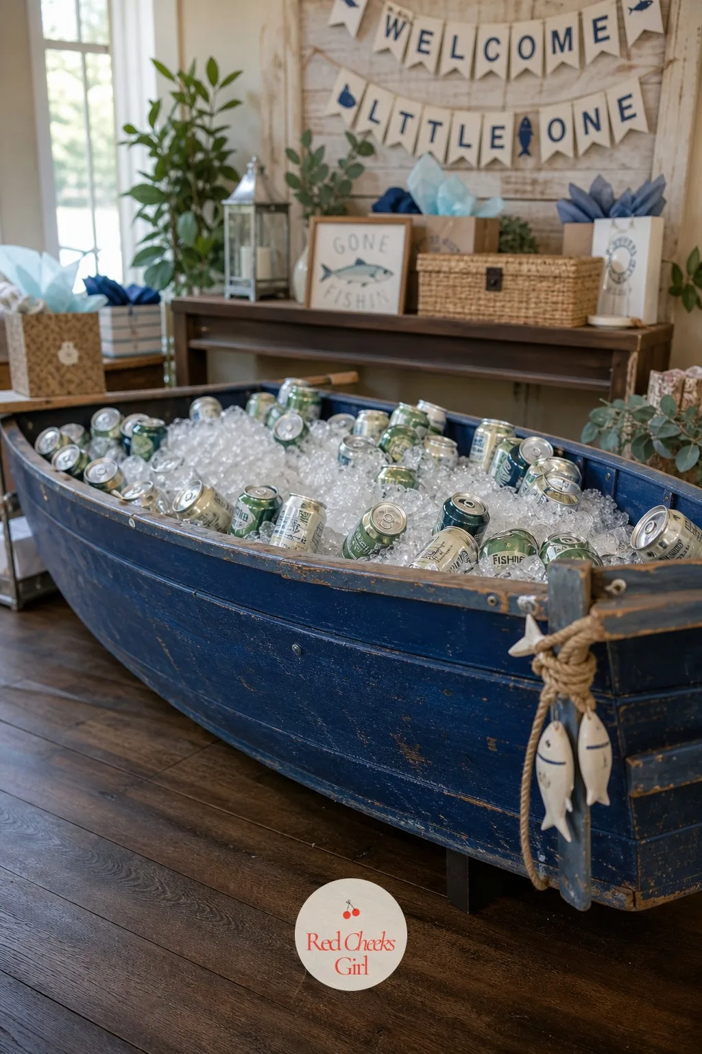A Rowboat Turned Drinks and Gift Display — A real wooden rowboat sounds like a hire-a-truck problem, and it can be if you let it. Fishing baby shower theme