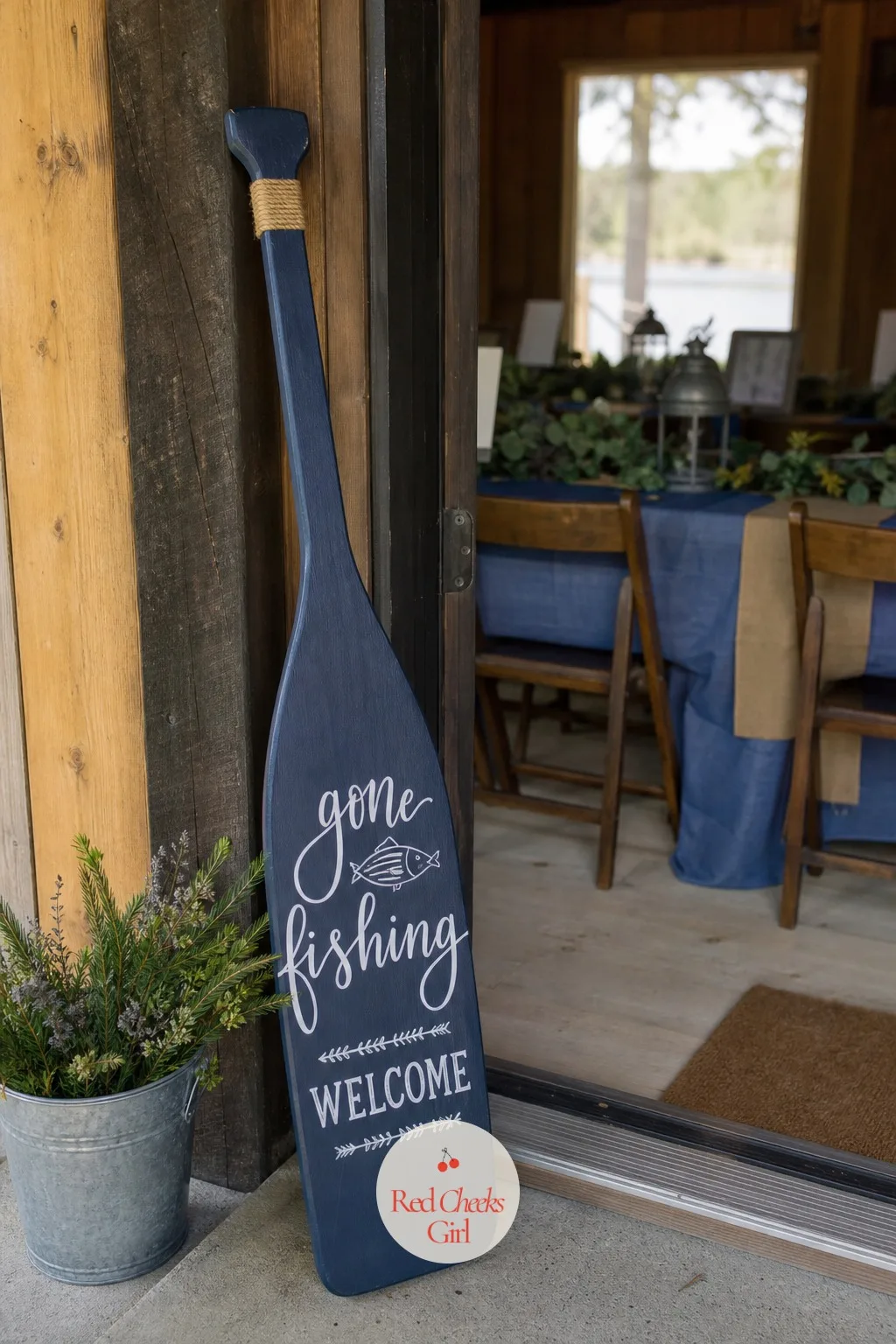 Gone Fishing Welcome Sign — A real wooden oar, painted navy with the words hand-lettered in white, does more to set the mood at the door than any printed sign