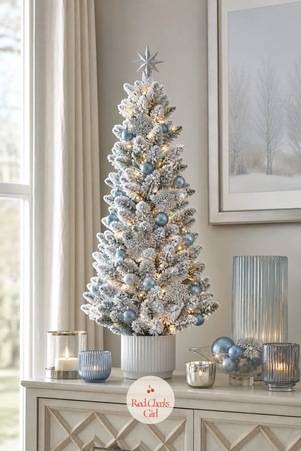 The Dusty Blue Tabletop Spruce — If the whole room cannot spare the floor space, let a small flocked tree take over a console or a side table instead. Flocked