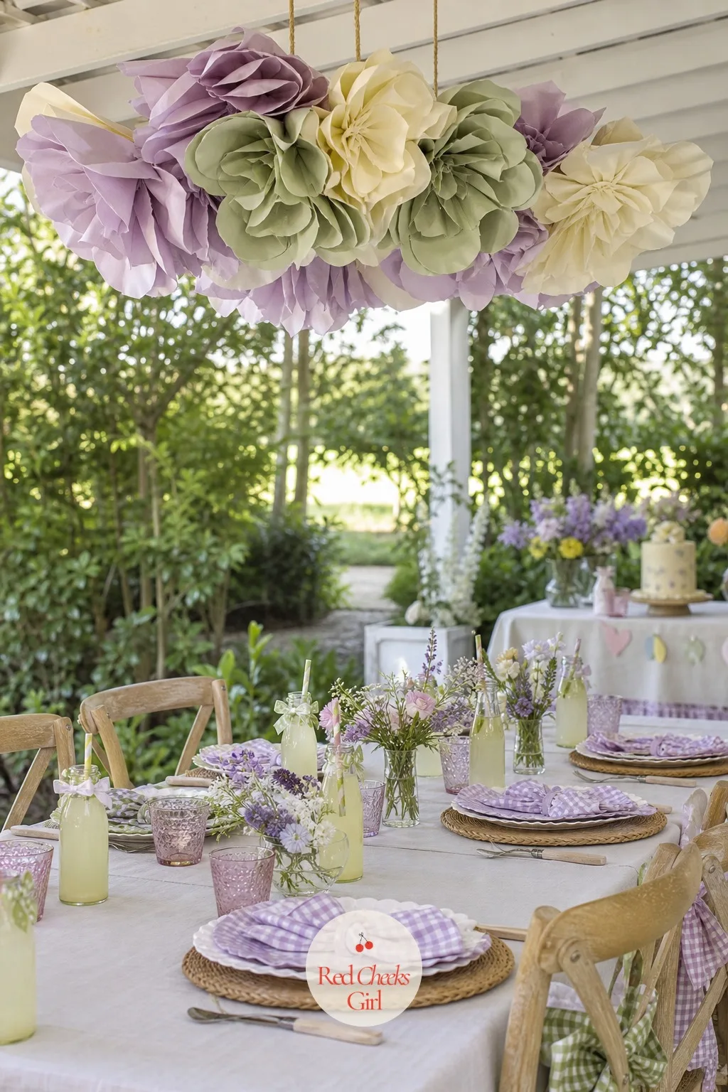 Hanging Paper Flower Chandelier Over The Long Table — A ceiling that does nothing is a missed trick at a flower party, and this fixes it without a single nail