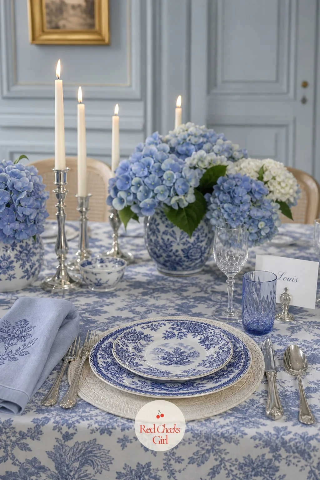 Blue and White Porcelain Place Settings — This is the motif at its most literal: the actual porcelain, blue pattern on white, sitting in front of every guest