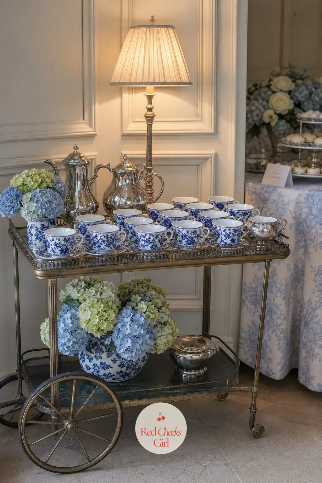A Coffee Cart with Blue and White Porcelain Cups — Somewhere near the cake, a small cart doing quieter work: coffee and tea for the guests who want something