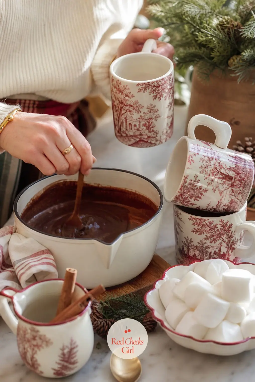 The Hot Chocolate Station, Set on the Counter — A small tray holds a pot of chocolat chaud, a stack of toile-print mugs, and a dish of marshmallows and