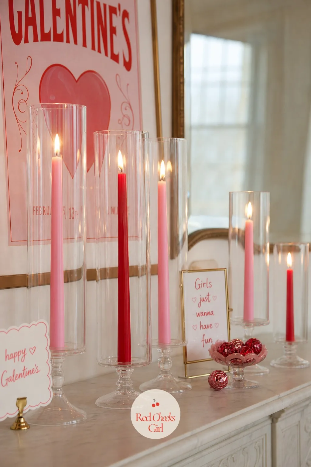 Pink and Red Candles in Glass Hurricane Holders — Overhead light flattens a room fast, and nothing kills a mood faster. Galentines party decor