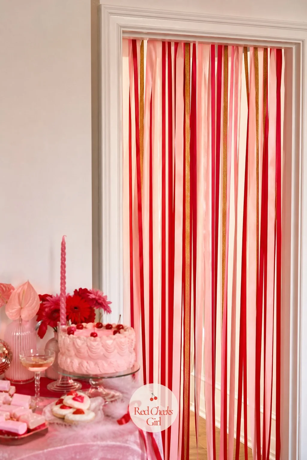 A Ribbon Streamer Curtain Hung in the Doorway — An empty doorway between rooms is a missed opportunity. Galentines party decor