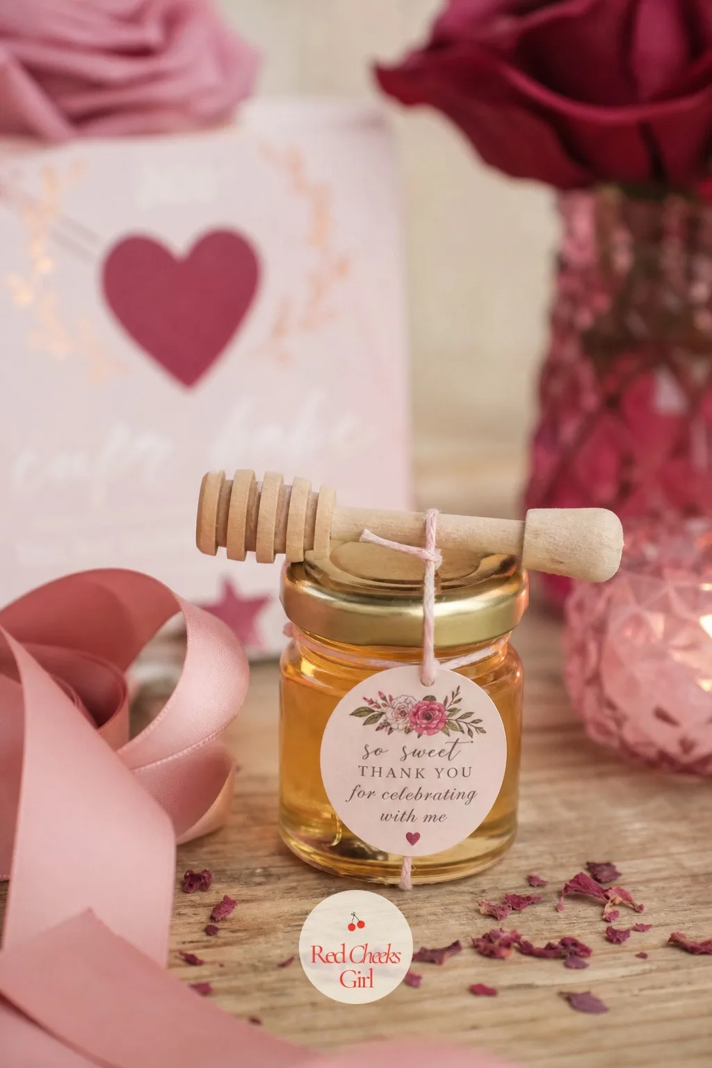 The Tiny Jar of Honey with a Dipper — A small glass jar of honey, barely bigger than a thumb, with a miniature wooden dipper resting across the top and held in