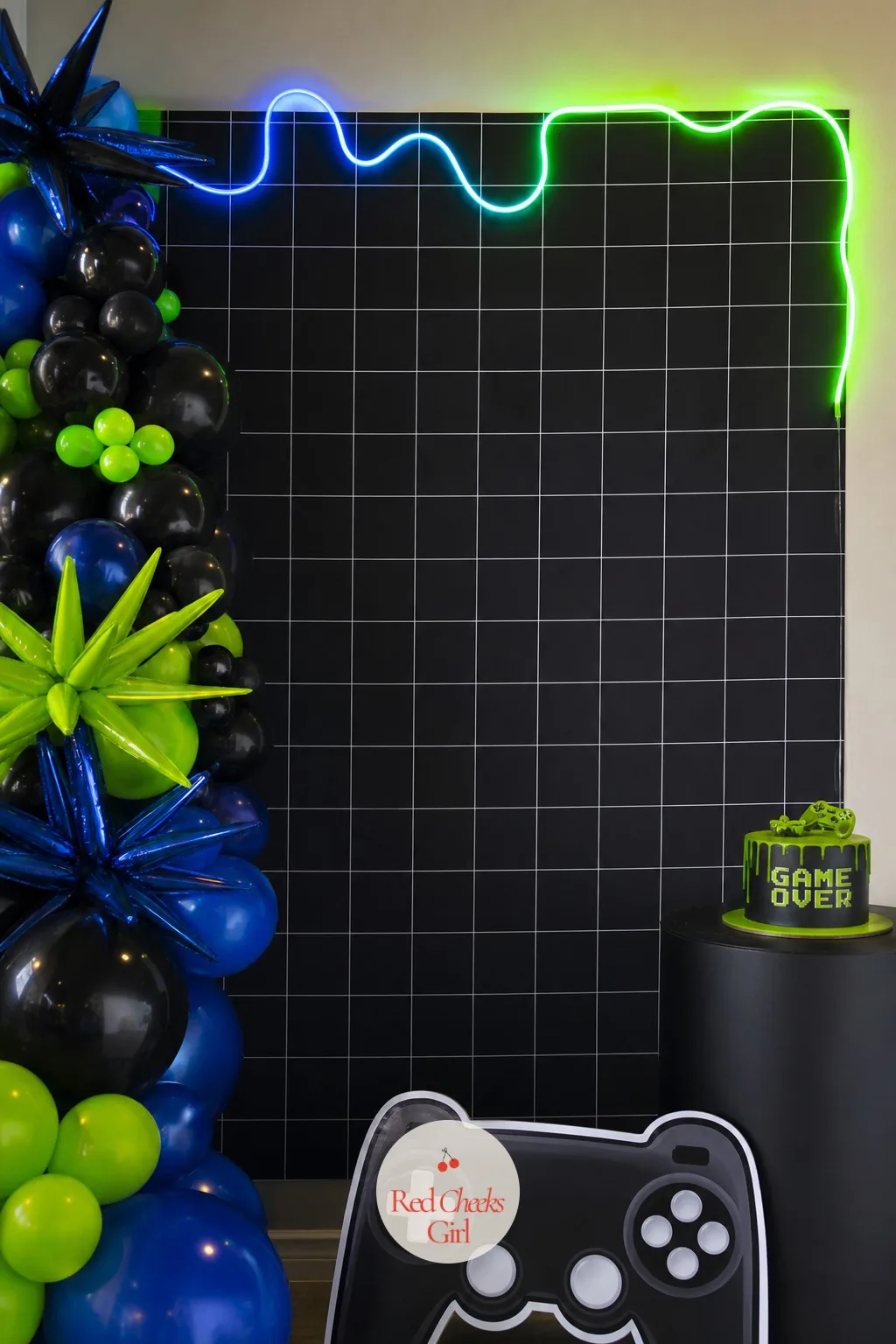 The Black Grid Backdrop — Walk into the room and this is the hit of colour that tells every guest exactly what kind of night this is. Gamer birthday party ideas