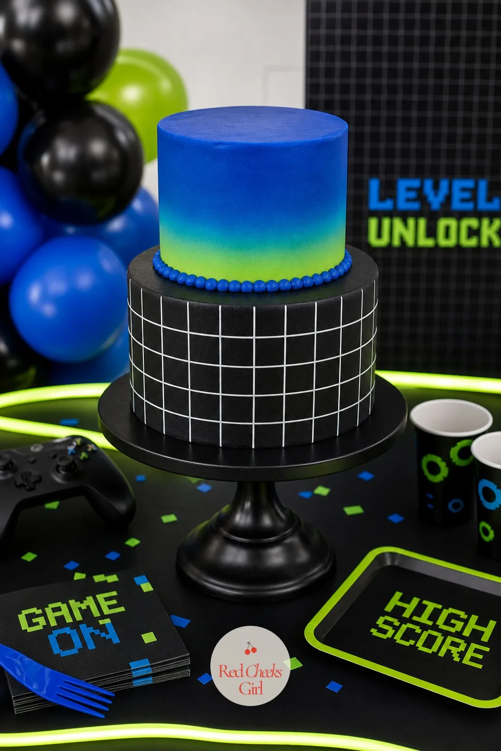 The Blue, Black and Green Tiered Cake — This is the centrepiece she will photograph before anyone is allowed to cut it. Gamer birthday party ideas