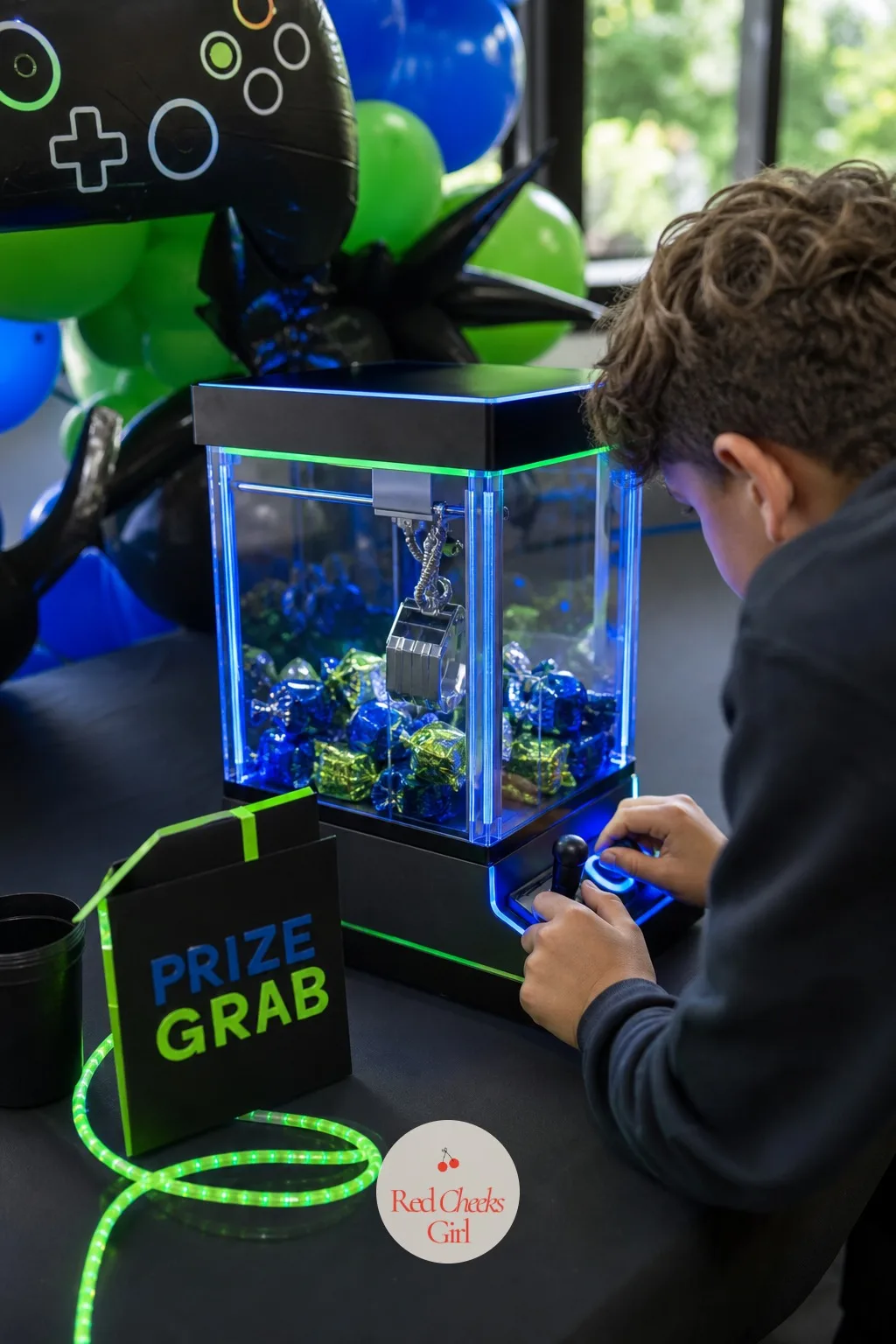 Claw Machine Prize Grab Station — Give the quieter guests something to do that does not involve a crowd watching them throw. Gamer birthday party ideas