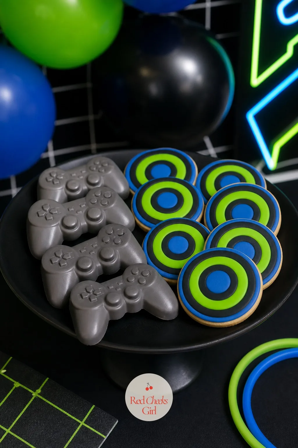 Controller-Shaped Chocolates and Button Cookies — These are the pieces people pick up before they even ask what they are. Gamer birthday party ideas