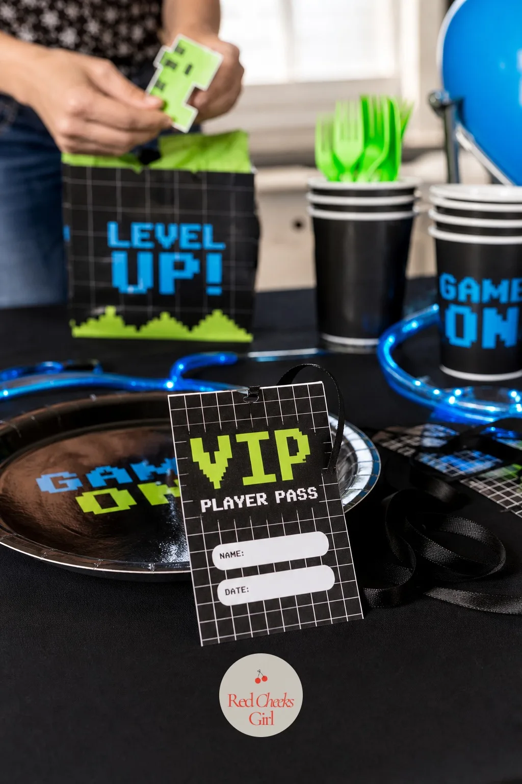 VIP Player Pass Tags — At each seat, one small card does double duty as a place setting and a keepsake, which is the kind of detail she notices without anyone