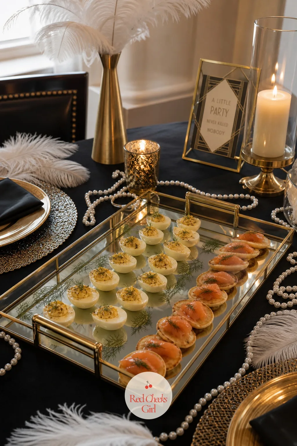 A Mirror Tray of Deviled Eggs and Blinis — Savoury food at this party stays small enough to eat standing up, mid conversation, mid champagne. Gatsby themed