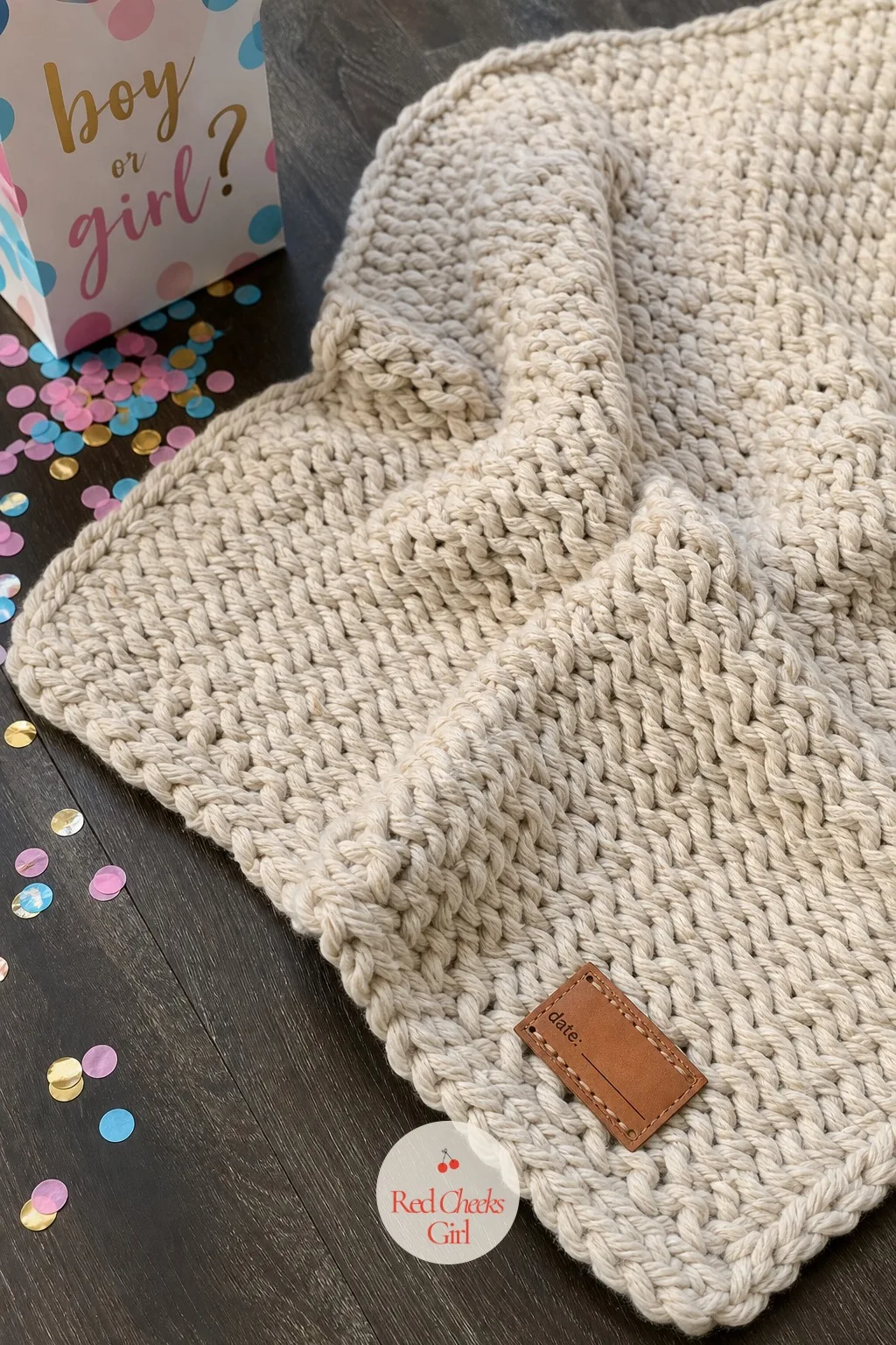 Chunky Knit Blanket With Leather Birth Tag — For a due date landing somewhere cold, something with real weight to it does more good than another thin cotton
