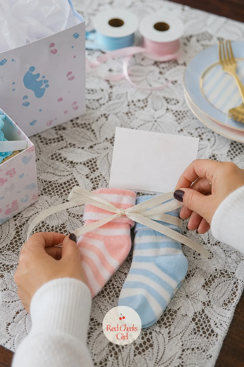 Tied Pair of Team Boy and Team Girl Socks — Small, cheap, and easy to overlook, except that these are the kind of thing a parent actually keeps in a drawer for