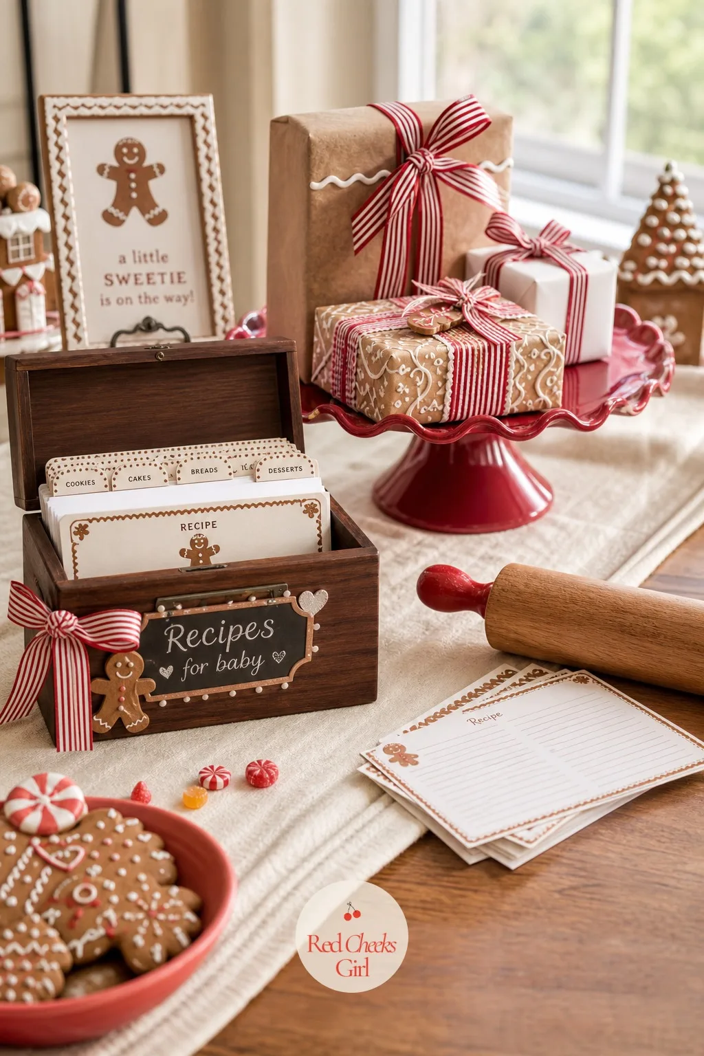 Recipe Box Gift Table — A table dressed with a cream runner holds a small recipe box standing in for an advice card holder, a rolling pin laid across one