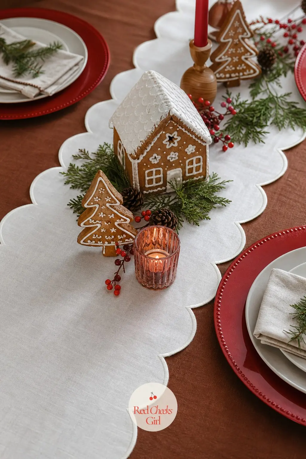 A Cinnamon Cloth Layered Under White and Red — Start with a cinnamon brown tablecloth, lay a white runner with a scalloped piped edge down the centre, and set